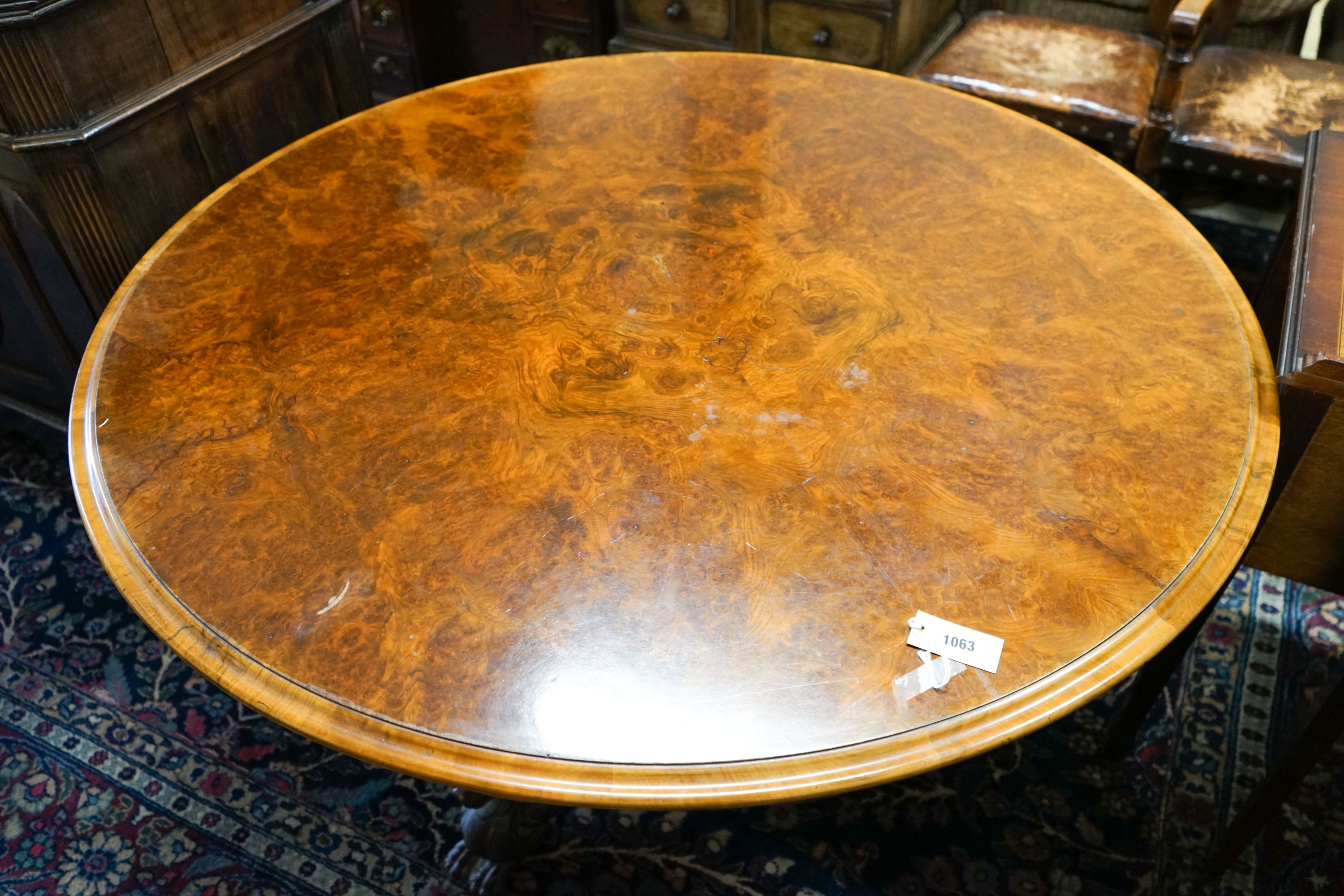 A mid-Victorian burr walnut-veneered circular tilt-top breakfast table, diameter 130cm, height 73cm